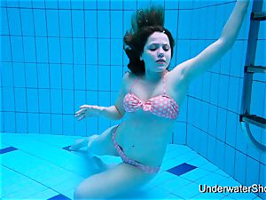 luxurious nymph showcases mind-blowing figure underwater